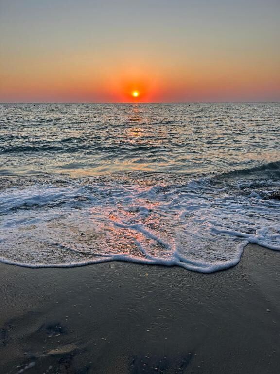 Sunset over the sea of San Cataldo, marina of Lecce in Salento