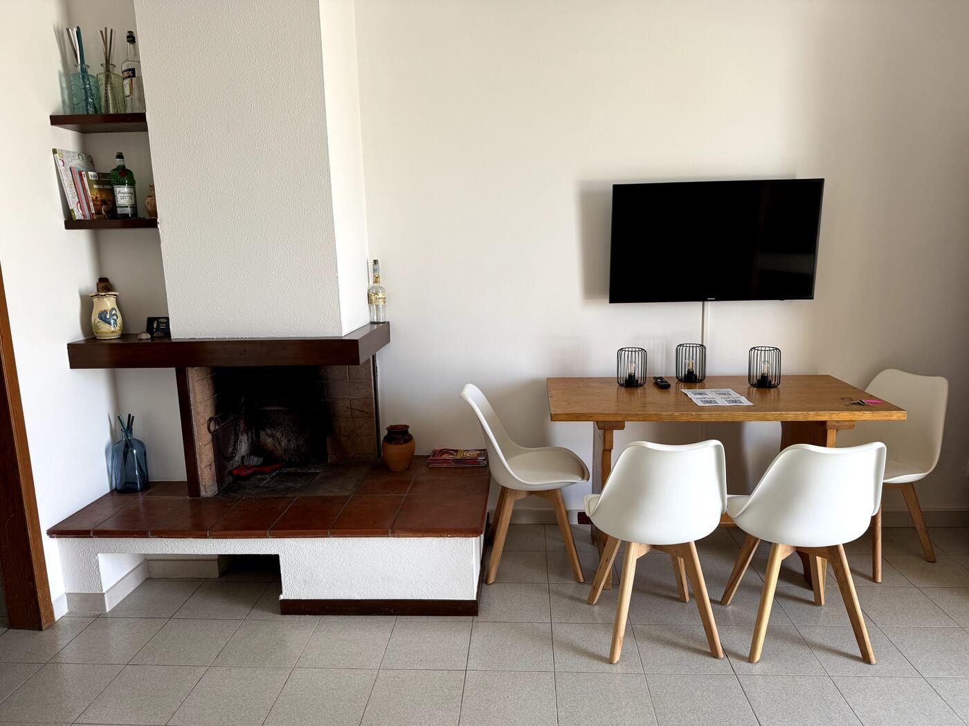 Indoor dining area with table and kitchen